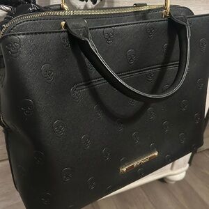 Black Skull Embossed Betsy Johnson bag